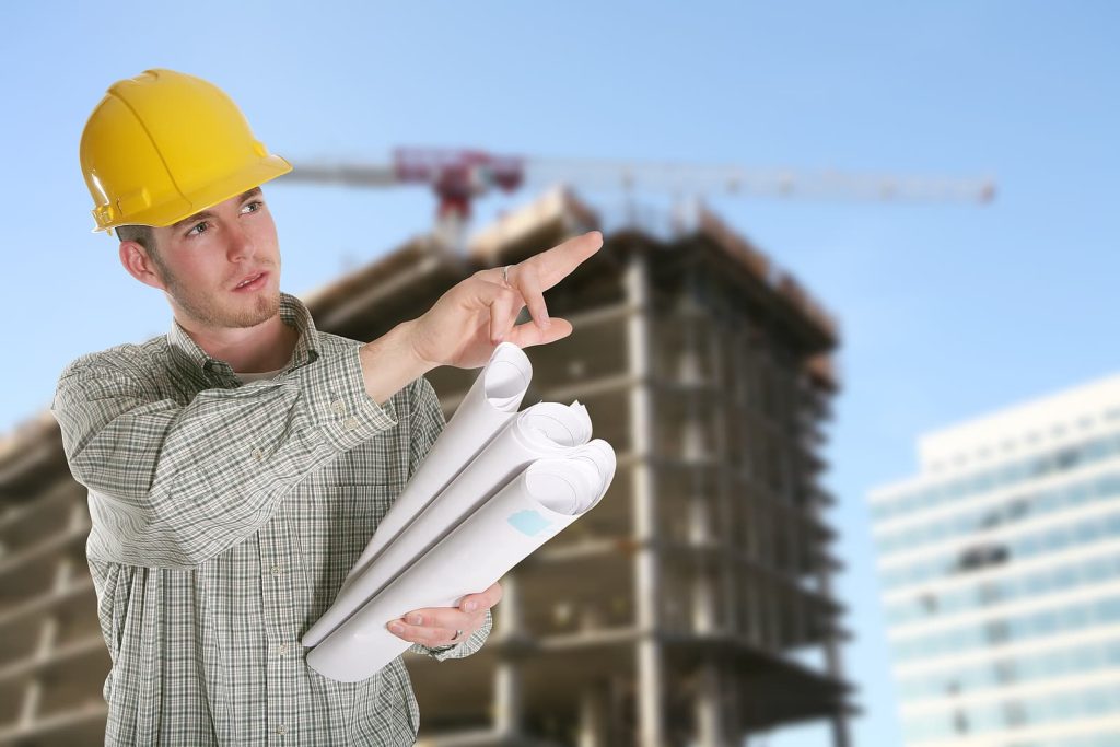 Passenger lift solutions - A construction worker with a building and crane